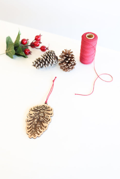 Round Pinecone Ornament by Jubilee Trading Company