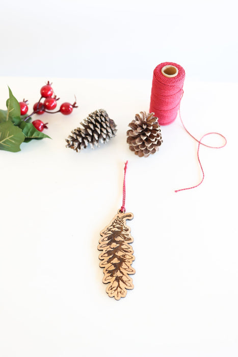 Long Pinecone Ornament by Jubilee Trading Company